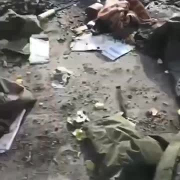 Destroyed russian vehicles and their trash on a village road, video from a few weeks ago
