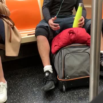 Man black outfit green water bottle dancing