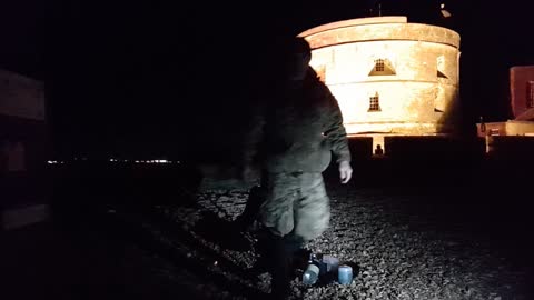 Light test before filming a night vlog at a castle.