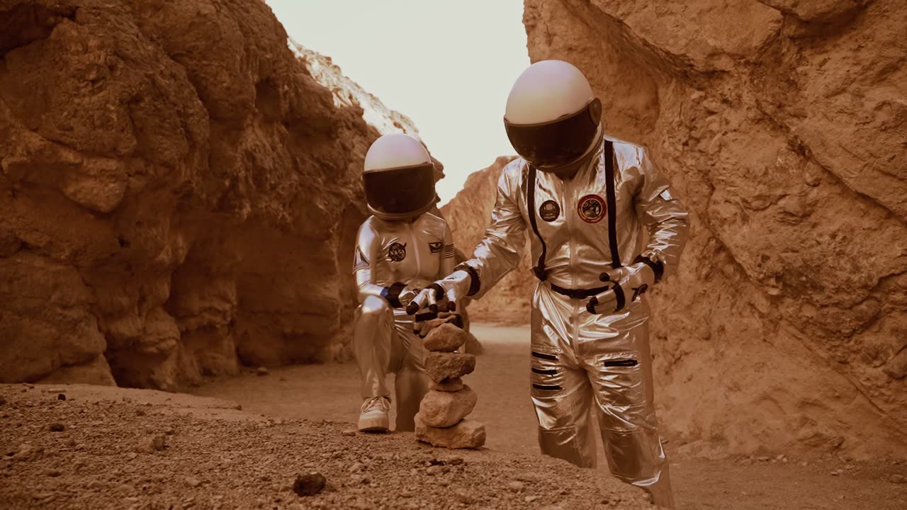 Astronauts stacking rocks