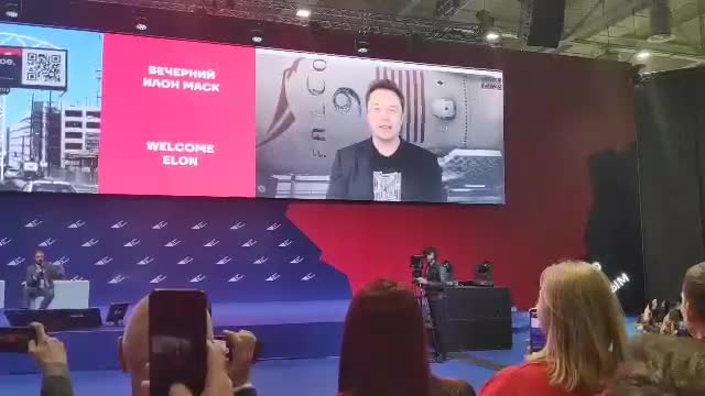 Elon Musk at a video conference with young russian businessmans