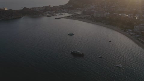 Motorboats, yachts and ships sailing near a beach