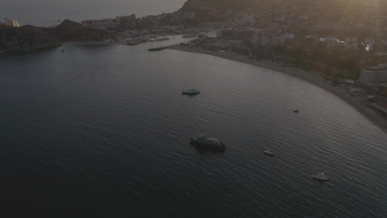 Motorboats, yachts and ships sailing near a beach