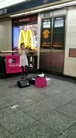 Music girl singing in front of mcdonalds subway