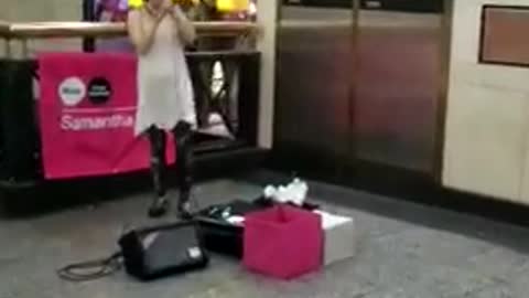 Music girl singing in front of mcdonalds subway