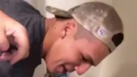 Guy throws up on friends head