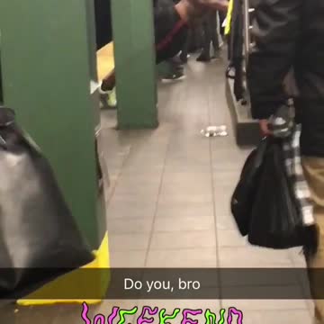 Shirtless black guy doing pushups on rail with black earphones on