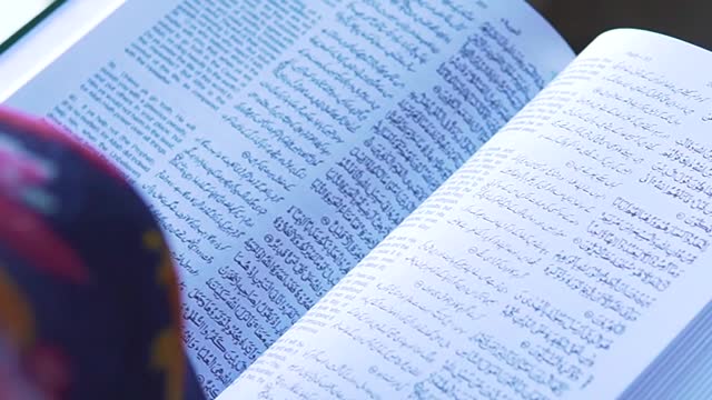 person-holding-a-quran