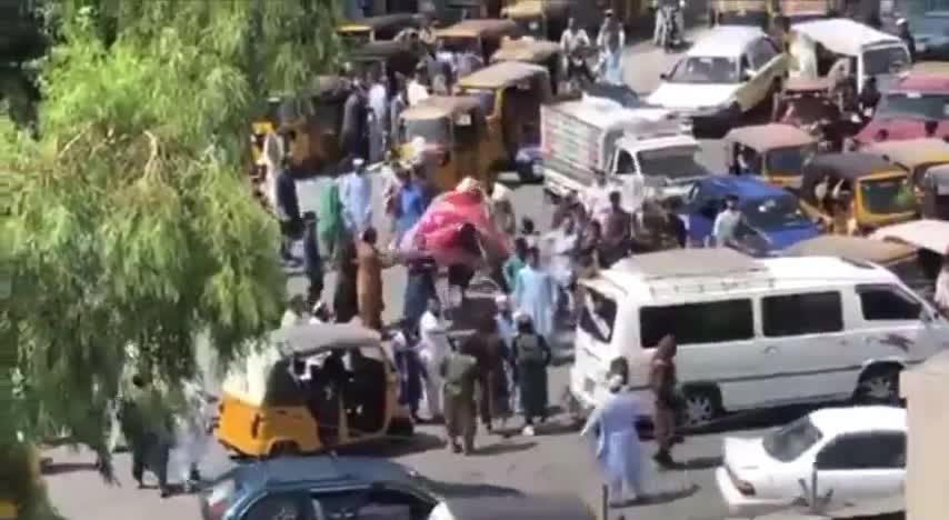 Taliban terrorists fire at peaceful protesters waving the Afghan flag.