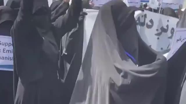 Fully covered Afghan women at a pro-Taliban protest on September 11