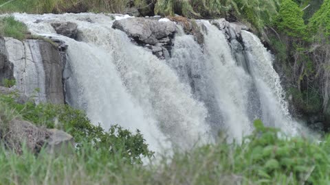 Rocky waterfall on a river in nature