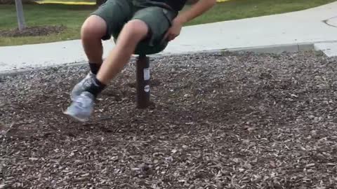 Guy at park spinning ride falls on head