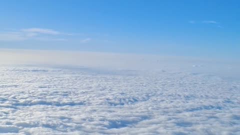 a sea of ​​clouds over a mountain