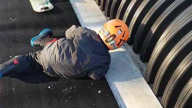 Kid goes on a snowboarding lesson, has more fun on the magic carpet