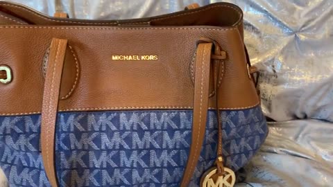 What's in my Michael Kors Denim Leather Signature Bag. Lucy has news!