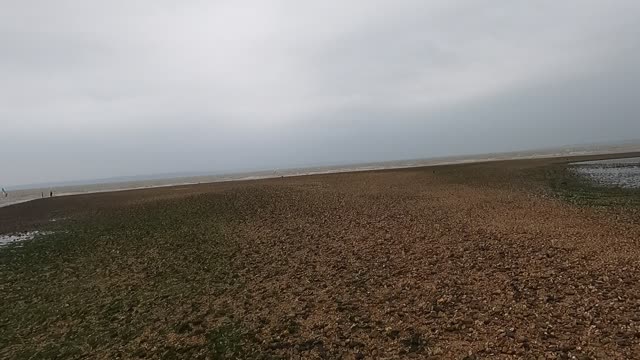 Low tide. Walking. Kitesurfing. Windsurfing.