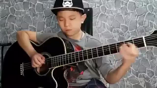 Show de um pequeno fera do violão