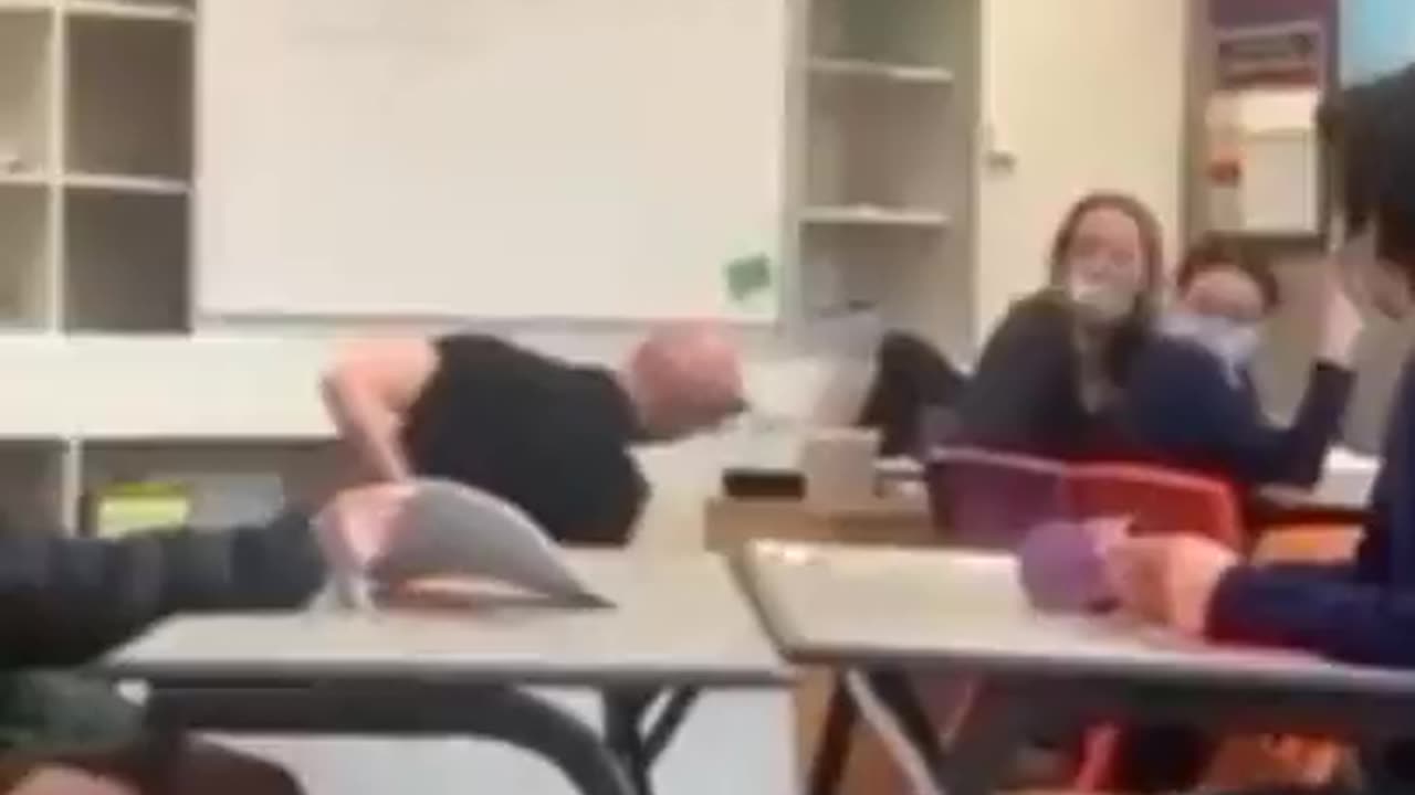 teacher tries to impress kids hand standing on table- doesn't end well.