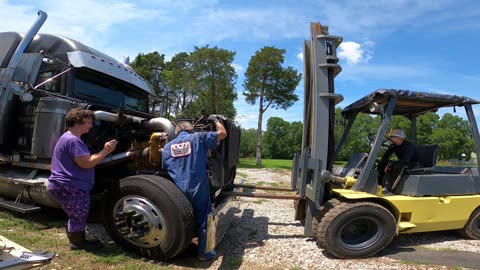 WIFE HOLDS UP FREIGHTLINER RADIATOR!