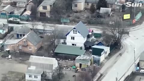 RUSSIAN 'Z TANK FIRES AT A CIVILIAN CYCLIST' IN BUCHA, UKRAINE