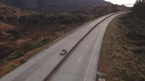 Traffic on the highway between the hills