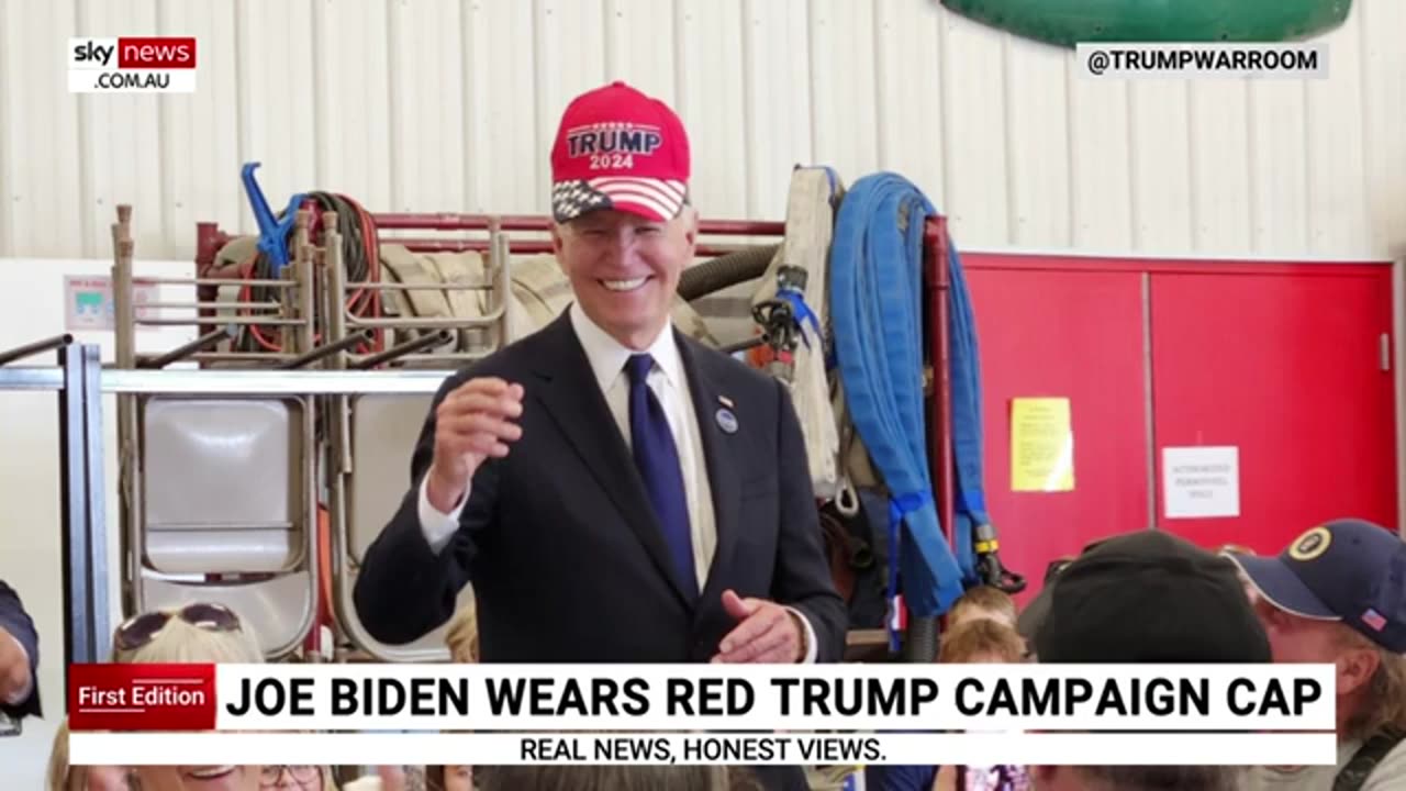 Joe Biden photographed wearing a Trump campaign hat