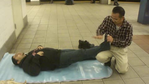 Luodong Massages Young Man In Hoodie At Subway Station