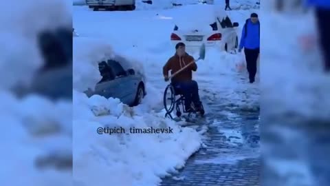 The guy, confined to a wheelchair, shoveled the snow himself to ride in a wheelchair.