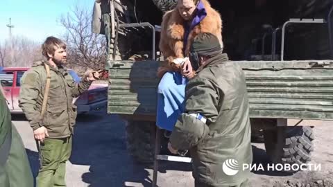 Ukrainian soldier/nationalist fighter attempting to flee from Mariupol disguised as a woman-refugee.