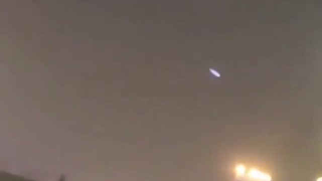Resident of a building films what would be a luminous UFO.