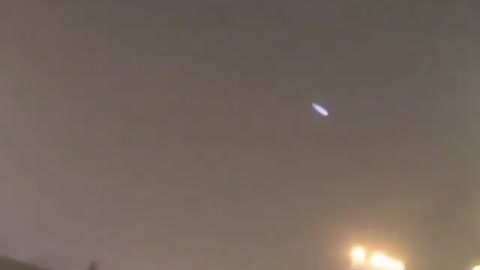 Resident of a building films what would be a luminous UFO.