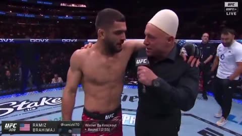 Ramiz Brahimaj put his hat on Joe Rogan