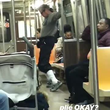 Man sunglasses grey sweater workout jump dance subway train