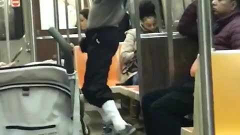 Man sunglasses grey sweater workout jump dance subway train