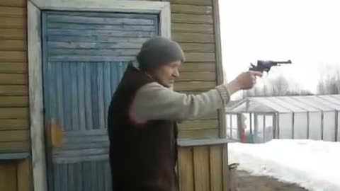 Russian grandmother shoots with a revolver