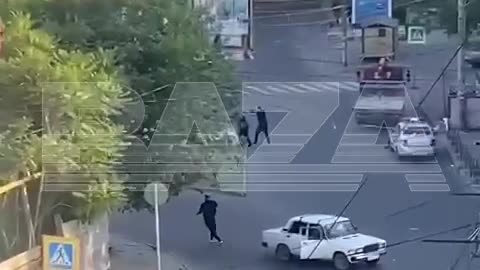 Shootout in Makhachkala, Russian Federation. Unknown men in black shooting at police cars.