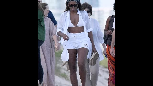 Enjoying some Miami heat! Michelle Obama in a white bikini as she and daughter Malia