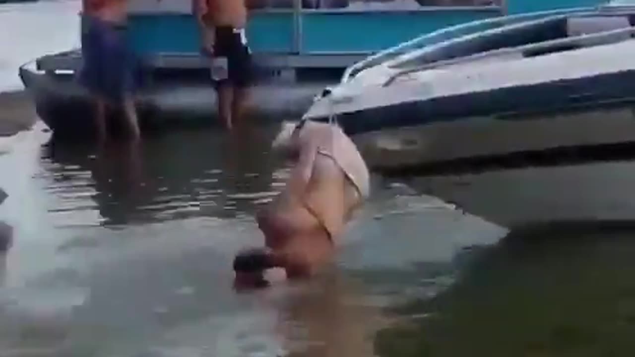 chick gets her bikini stuck on the boat.