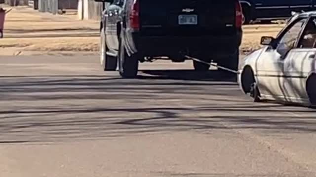 SUV Drags along Tireless Car