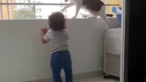 Cute cat is trying to protect this little boyl😍😍