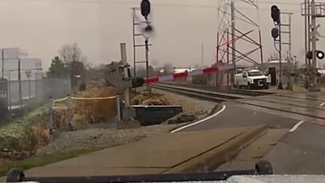 DamCam Captures Police Officer Escaping Near Death At Train Tracks