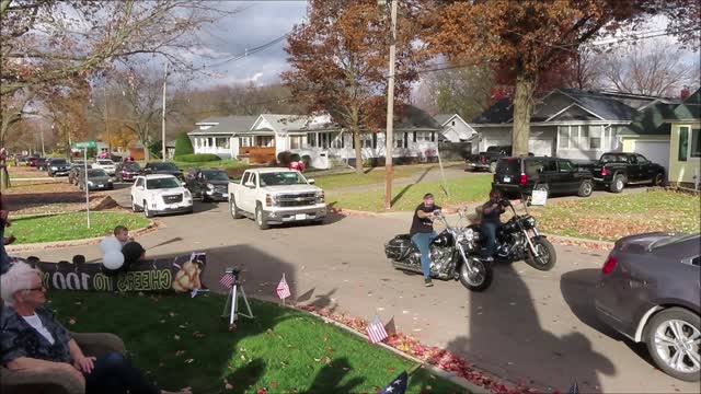 100 year old Vet waves his flag to parade participants