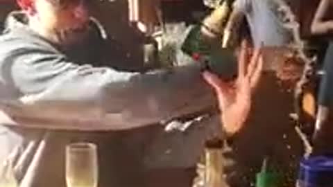 Guy Opening Champagne Drops Bottle on Floor!