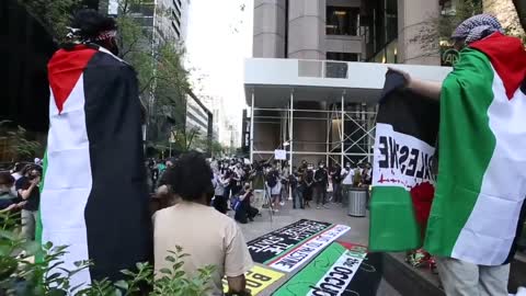 Pro-Palestine protesters burn Israeli flag as they protest attacks in New York