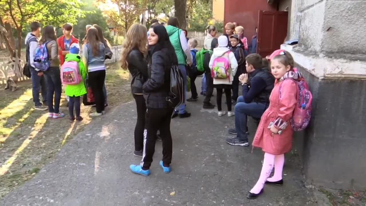 Children in school under shelling in Donbass