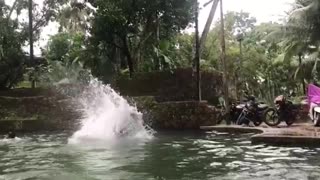 boys taking bath with friend in small water