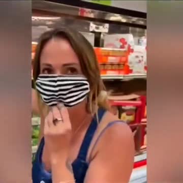 Shopper intentionally coughs on videographer