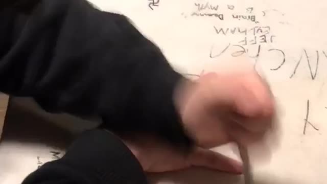 Guy plays knife hand game and stabs ring finger, starts bleeding