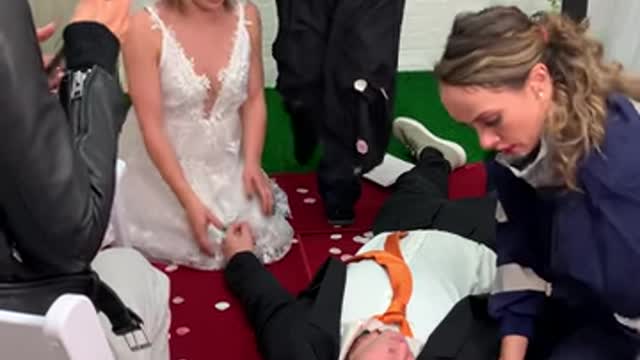 GROOM has heartattack at altar , EMT runs in to help. was a close call