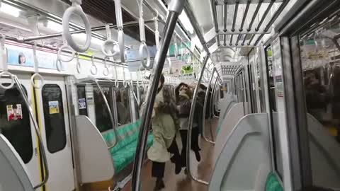 Man with a knife sets a train in Tokyo on fire